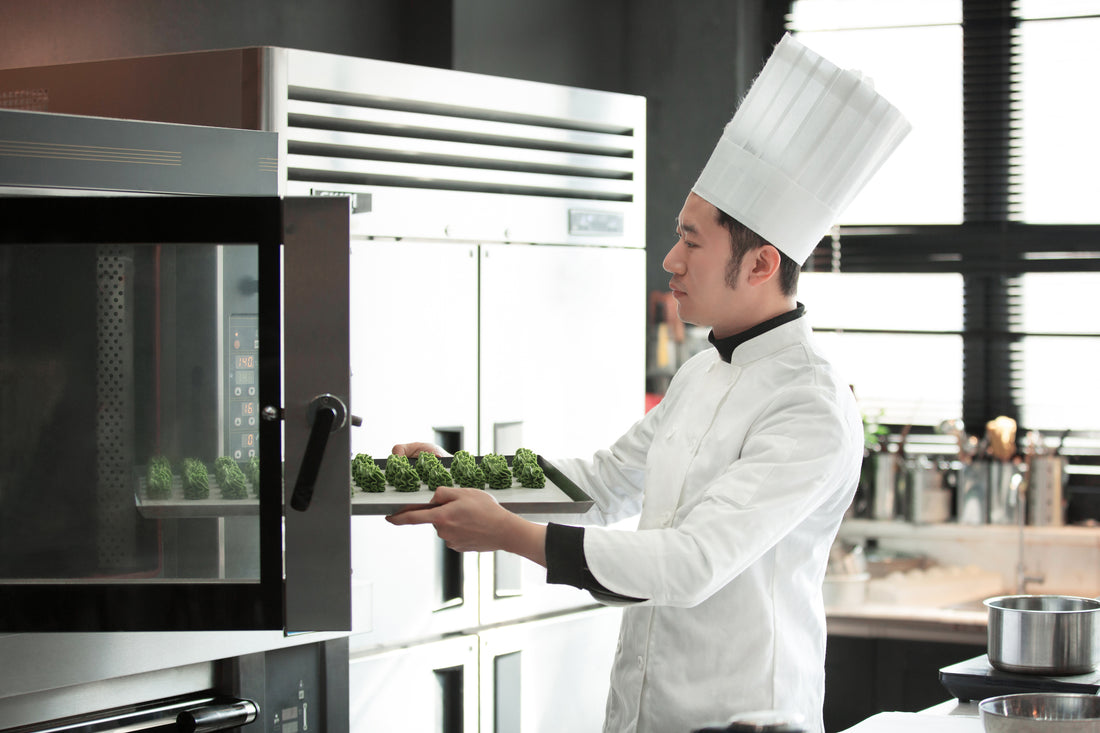 Chef with a convection oven and baking trays